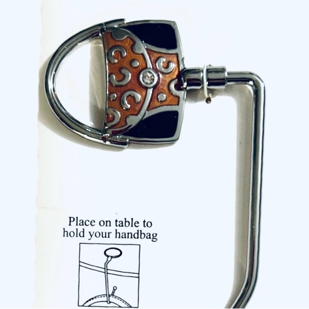 Keep your handbag off the floor with this stylish holder for table.
